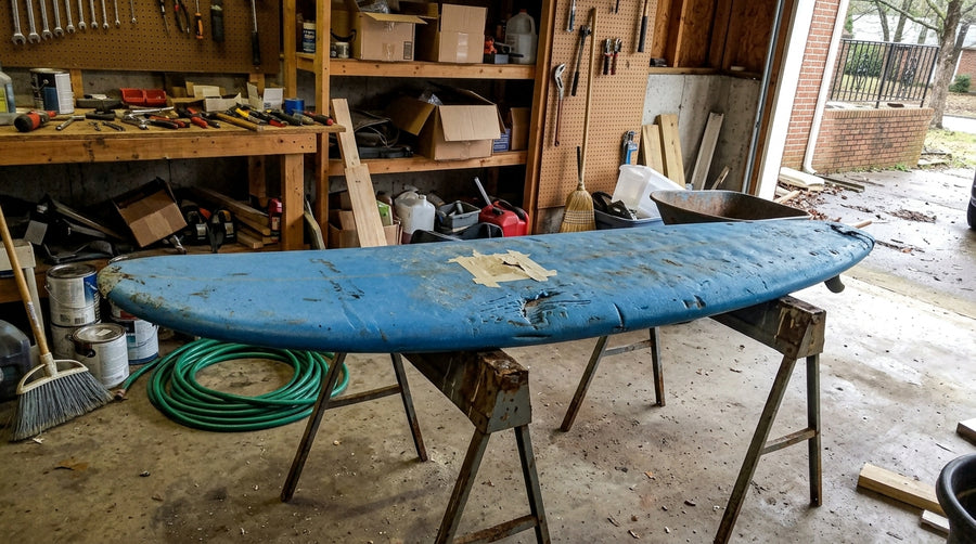 Masking tape applied around an area to be repaired on a foam board