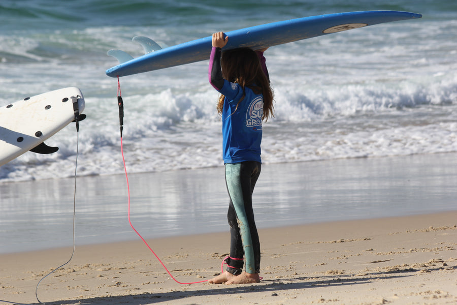 Kids foam surfboards in different sizes lined up