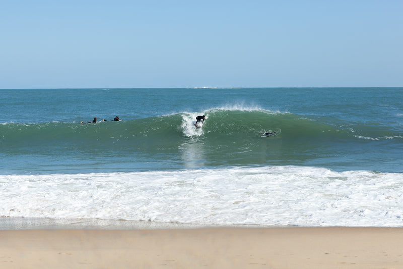 Surfers spread out across the line-up on the Landes coast