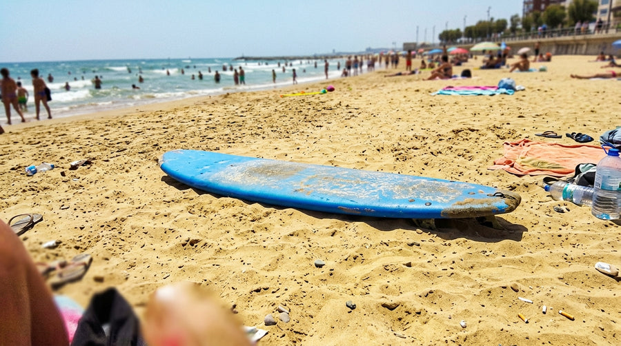 The areas of a foam surfboard: deck, bottom, rails and fin box